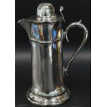 A Victorian ecclesiastical style lidded flagon, with tapering sides, scroll cast handle, 25cm high