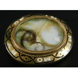 A Victorian memorial brooch, with surrounding black and white enamel, inscribed In memory of, with