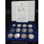 A collection of silver commemorative coins, from the Endangered Wildlife Series, with certificate