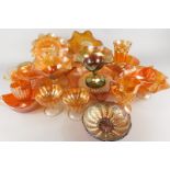 A large quantity of marigold coloured Carnival glass, to include bowls, sundae dishes, jugs etc.,