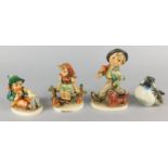 A collection of ceramics, to include three Hummel figures and a Goebel bird