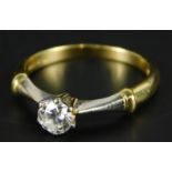 An 18ct gold diamond solitaire ring, with diamond approx 0.3cts, with white metal coloured