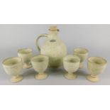 A Rushton Isle of Man stoneware studio pottery flagon and six goblets