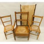 A vintage striped deck chair, a commode chair and two bedroom chairs