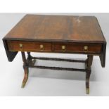 An early 19thC rosewood sofa table, the rectangular top with a reeded edge, above two frieze drawers