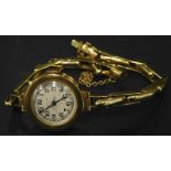 A ladies round faced wristwatch, on expanding bracelet, marked 18ct, 18.4g all in