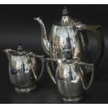 A heavy silver plated three piece tea set, in mid 20thC British style, with ebonised knop and handle