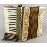 A Hohner Student III piano accordion, with leather strap