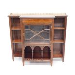 A late Victorian/Edwardian mahogany breakfront side cabinet, with a gilt metal gallery above a