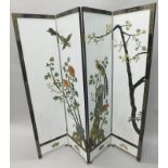 An oriental lacquer type screen, decorated with exotic birds, flowering branches etc., in hard