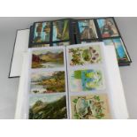 A quantity of coloured photographic postcards, and an album containing a number of early 20thC and