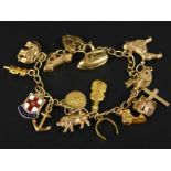 A 9ct gold charm bracelet, on curb link chain bracelet, with padlock, with 15 charms, all yellow