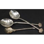 A pair of Chinese white metal spoons, each with an English monogram engraved to the centre of the