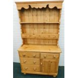 A 19thC and later pine dresser, the top with two shelves and four drawers, the base with an