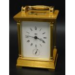 A Dent of London brass carriage clock, with repeat and alarm function, the gilt brass case glazed to