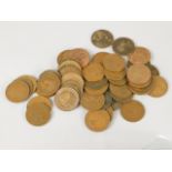 A large quantity of British copper coins, some uncirculated, half pennies, etc.