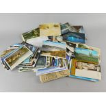 A large quantity of loose postcards etc., various first day covers, albums of postcards etc (3