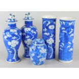 Five items of Chinese porcelain, each decorated in blue and white with the prunus pattern, to