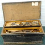 An ebonised pine cabinet maker's tool chest, containing a large number of tools, the chisel