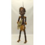 Tribal Art. An African full size carved figure, with simulated hair, shells for eyes etc., with