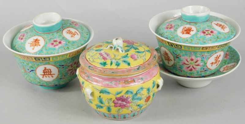 A late Chinese porcelain box and cover, decorated with leaves, flowers etc., two rice bowls with