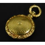 A gilt metal locket, with floral scrolled borders, with initials GH EL.