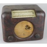 A brown Bakelite cased radio, (AF)