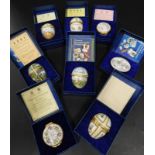 A collection of eight Halcyon Days enamel boxes, various subjects to include eggs