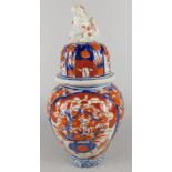 A late 19th/early 20thC Japanese Imari jar and cover, with a Dog of Fo finial, 27cm high