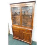 A 19thC mahogany bookcase, the top with two glazed doors enclosing adjustable shelves, the base with