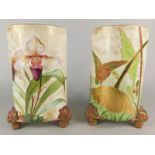 A pair of Staffordshire ceramic vases, each decorated with birds, flowers, berries, leaves etc.,