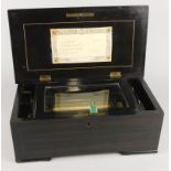 A late 19thC/early 20thC Swiss musical box, with brass cylinder playing four airs, numbered 27708,