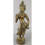 A silvered metal Indian style figure of a goddess, on an oval beaded base, possibly Parvati, 51cm