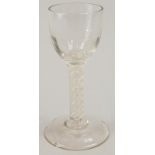 An 18th/19thC wine glass, with a bell shaped bowl, an opaque twist stem, on a domed foot (AF),