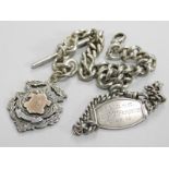 A silver watch chain and an identity bracelet, the curb link watch chain with T bar and crest fob,