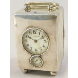 A late 19th/early 20thC Italian carriage clock, the white metal case with a loop handle, the