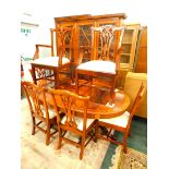 A mahogany dining room suite, comprising extending dining table with cross banded and carved