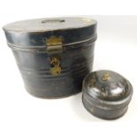 A late 19th/early 20thC black painted tin hat box, and a tin spice container (2)