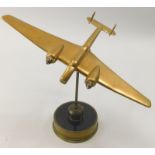 A scale model of a Handley Page Hampden aircraft, in brass and copper, on circular base, 24cm