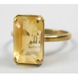 A 9ct gold dress ring, with rectangular yellow coloured stone, in claw setting, boxed, 3.9g all in.