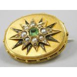 A Victorian memorial brooch, set with peridot and seed pearl, in a star design, yellow metal,