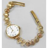 A Rotary 9ct gold wristwatch, with a small white enamel dial, on a fan design bracelet, 11.6g all