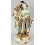 A Rudolfstadt porcelain figure group, modelled in the form of a dandy and a lady with a posy and
