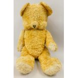 A gold cotton plush teddy bear, 47cm long