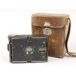 A C P Goerz Tenax strut folding plate camera, early 20thC, in leather carrying case with strap, case