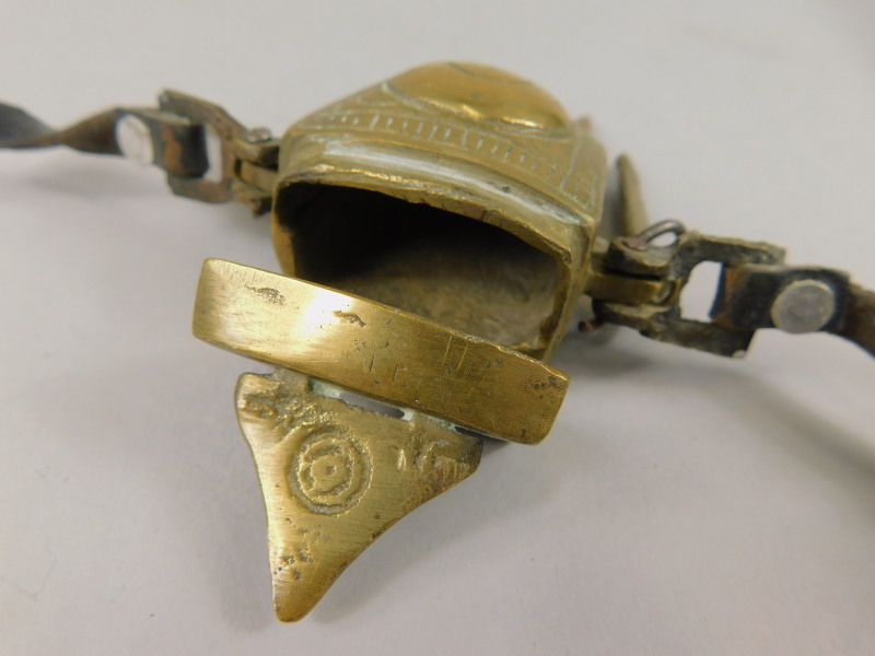 A Middle Eastern match container, with leather belt attachment and various striking mechanisms, - Image 2 of 2