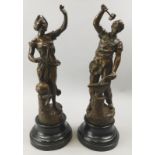 A pair of late 19th/early 20thC French spelter figures, depicting a blacksmith and a lady beside a