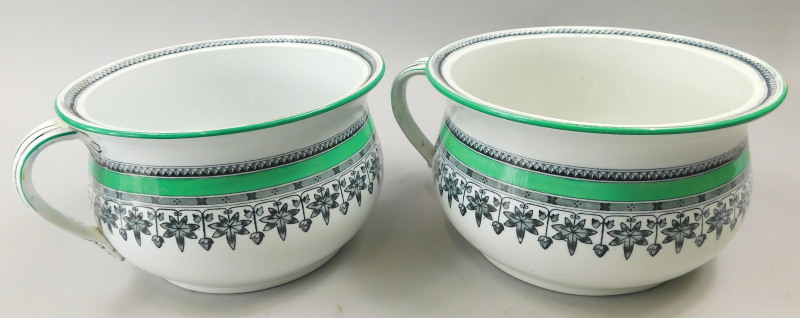 A pair of Victorian Copeland chamber pots, each printed with leaves etc., within green bands,