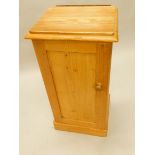 A 19thC pine bedside cabinet, with single panelled door on a plinth base, 38cm wide