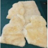 Various sheepskin and other rugs.